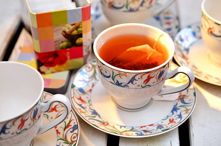 white teacup on top of white saucer thumbnail