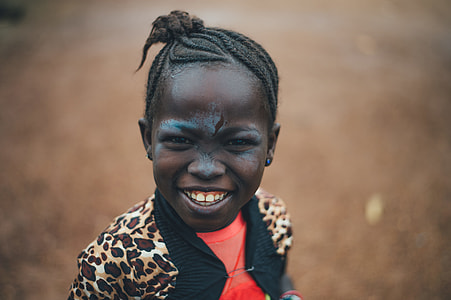 close up photography of girl wearing leopard printed jacket thumbnail