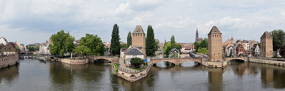 beige and brown house beside body of water thumbnail