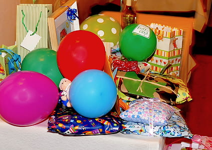 balloons and gift wraps beside wall thumbnail