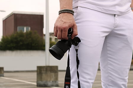 Man Holding Dslr Camera thumbnail