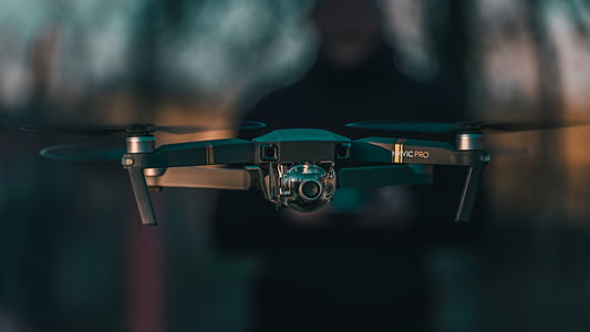 shallow focus photography of black quadcopter thumbnail