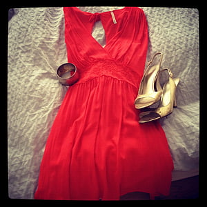 red sleeveless V-neck top on white textile thumbnail