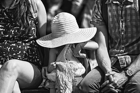 child sitting on chair with woman and man thumbnail