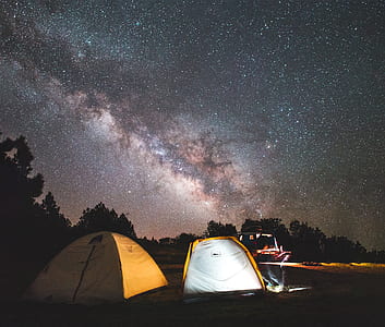 two brown-and-yellow tents under starry night thumbnail