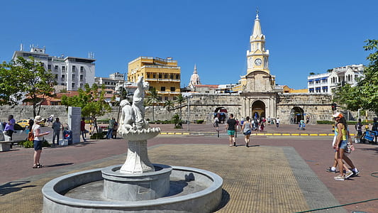plaza with fountain near clock tower building at daytime thumbnail
