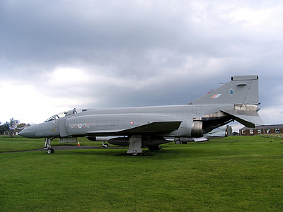 gray fighter jet on green grass thumbnail