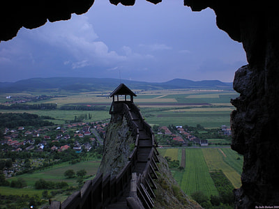 temple on top on rocky mountain beside town with rice field thumbnail