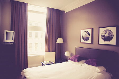 brown wooden bed near opened window thumbnail