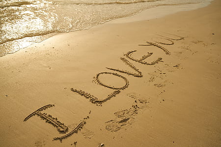 brown sand with I LOVE YOU text during daytime thumbnail