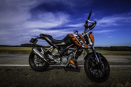 orange and black KTM Duke motorcycle thumbnail