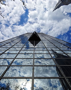worm's-eye view of high-rise building under cloudy sky thumbnail