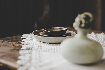 round white ceramic containers on tabletop thumbnail