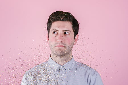 man in grey collared top looking at right side thumbnail
