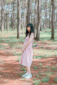 Woman Wearing Pink Sleeveless Dress thumbnail