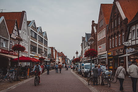 People Walking on Road Beside Buildings thumbnail