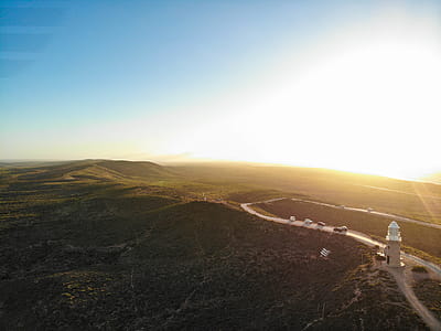 Aerial Photography of Gray Lighthouse on Hill thumbnail