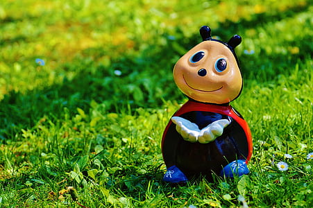 ladybug character toy on grass at daytime photo thumbnail