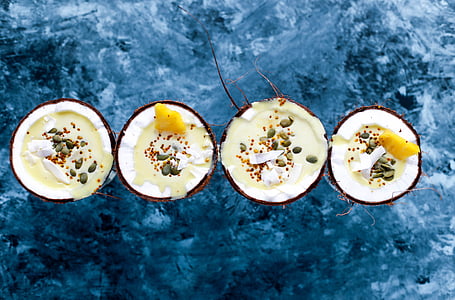 sliced coconuts with milk and fruit slices thumbnail