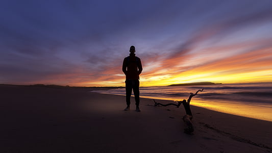 man standing on seashore thumbnail