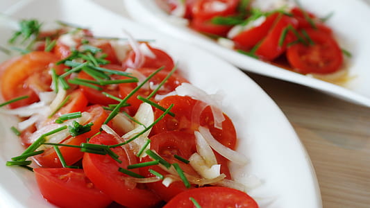 slices of tomatoes on white plate thumbnail
