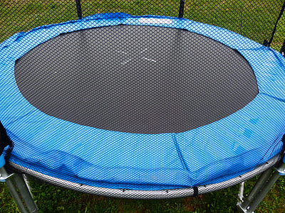 closeup photo of black trampoline with enclosure thumbnail