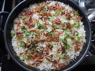 rice and vegetables in wok thumbnail