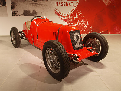 red vehicle on white floor thumbnail