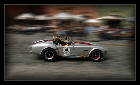 selective focus photography of two persons riding car thumbnail