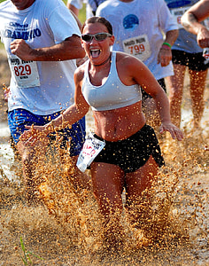 group of people run on muddy water thumbnail