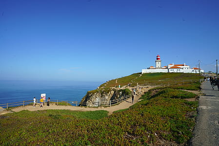 Wide Angle Photo of Lighthouse Under Blue Sky thumbnail