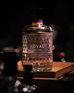 shallow focus photography of Koval dry gin bottle on the table thumbnail