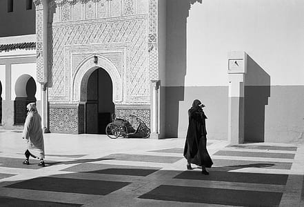 grayscale photo of man walking thumbnail