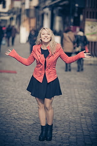 shallow focus photography of woman in red double-breasted pea coat thumbnail
