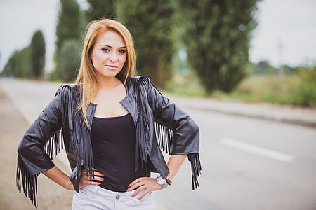 long blonde-haired woman in black leather jacket thumbnail