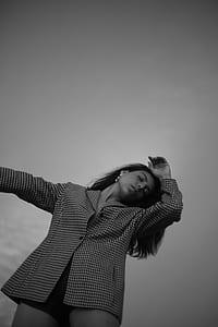 grayscale photo of woman staring down thumbnail