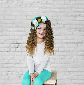 smiling girl sitting on chair thumbnail
