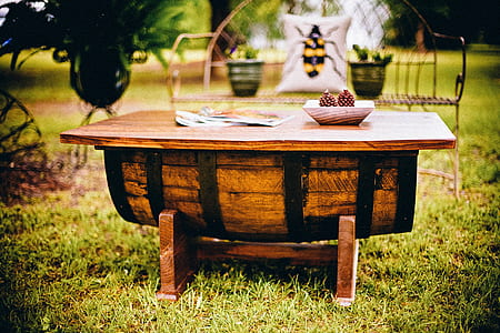 selective focus photo of barrel table on grass thumbnail