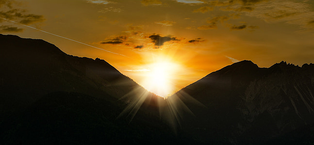 silhouette of mountains during golden hour thumbnail