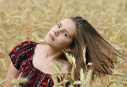 woman wearing red and black floral top thumbnail