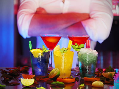 selective focus photography of five assorted-flavor drinks surrounded by lemon slices thumbnail