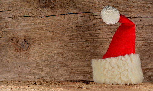 Santa hat on wooden surface thumbnail