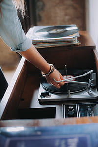 person holding turntable pin thumbnail