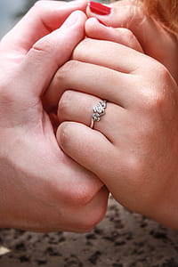 woman wearing silver-colored ring thumbnail