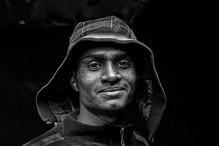 grayscale photo of man wearing hoodie thumbnail