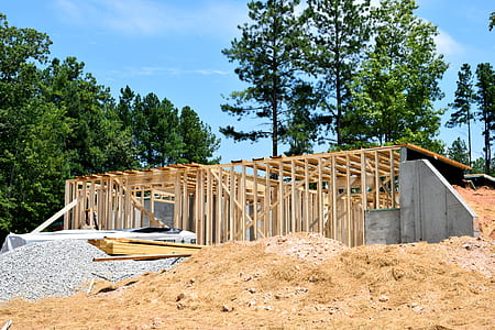 brown wooden scaffolding near trees at daytime thumbnail