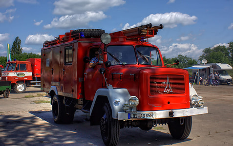 parked red firetruck during daytime thumbnail