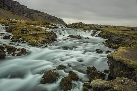 body of water between rock formation thumbnail