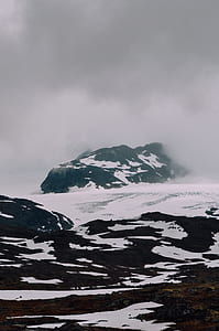 snowy mountain range during daytime thumbnail