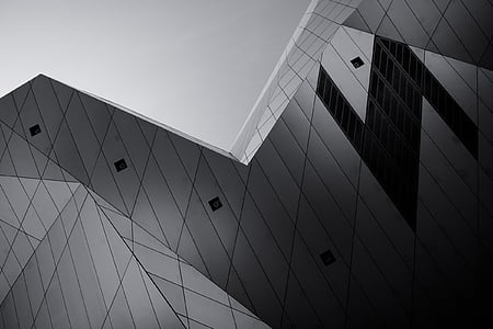 low-angle and grayscale photography of curtain wall building thumbnail